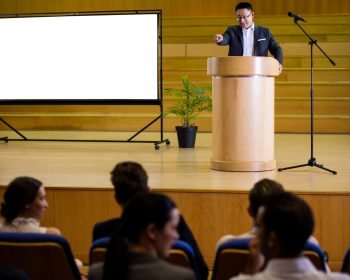Business executive giving a speech at conference center Business executive giving a speech at conference center