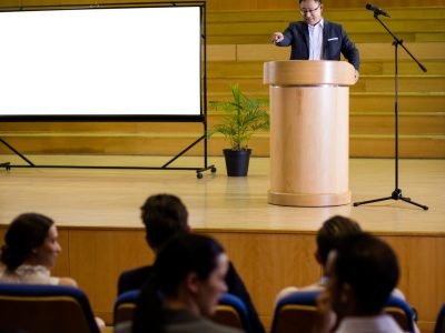 Business executive giving a speech at conference center Business executive giving a speech at conference center